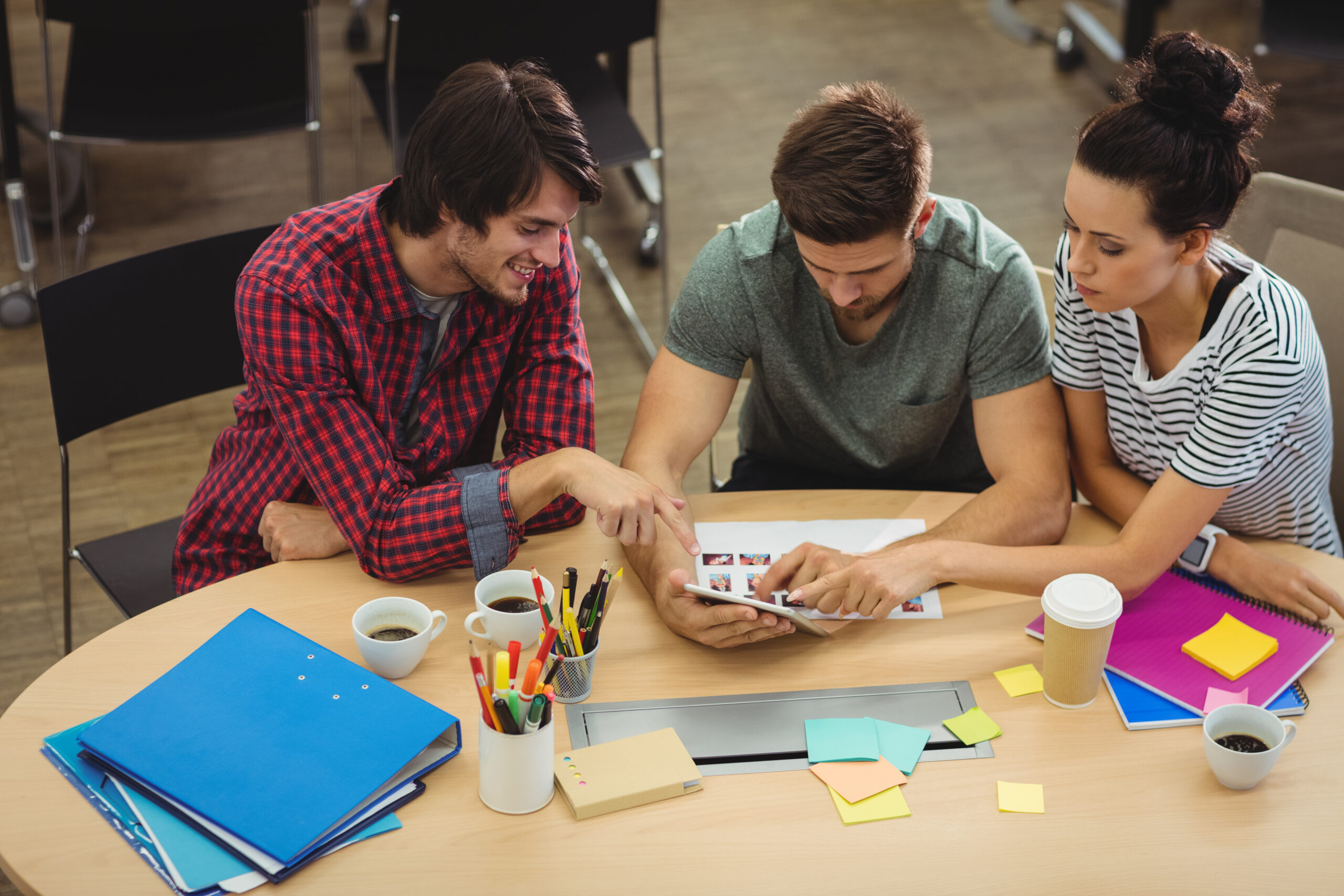 Graphic designers interacting at their desk